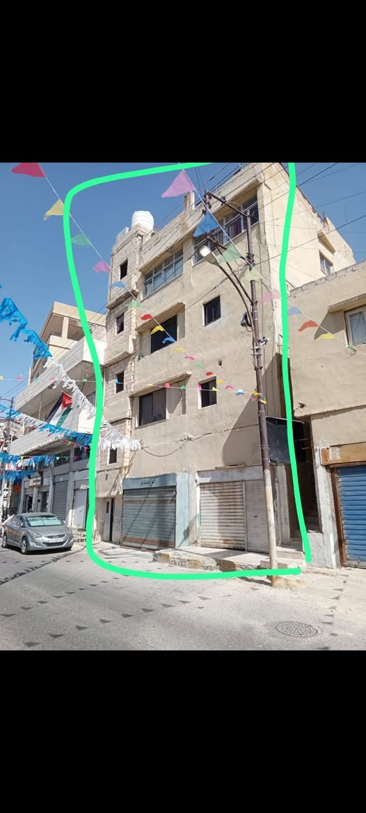 عمارة استثمارية بـ 3 شقق في جبل الجوفة