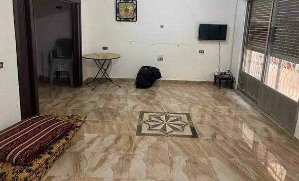 شقة شبه أرضي مع حديقة في جبل الحسين